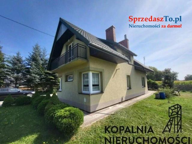 Dom jednorodzinny z garażem i stawem. Działka 4111m2.